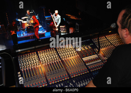 Sound technician at work at rock concert Stock Photo