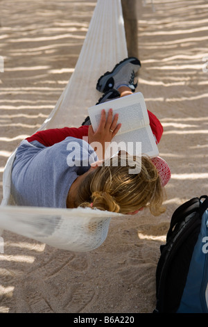 Mexico, Quintana Roo, Xel-Ha, Xel-Ha nature / marine park, Tourist in hammock. Stock Photo