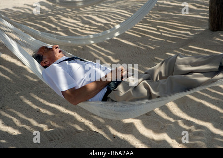 Mexico, Quintana Roo, Xel-Ha, Xel-Ha nature / marine park, Tourist in hammock. Stock Photo
