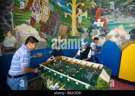 Mexico, Tepoztlan, near Cuernavaca, Mural near market. Boys playing games. Stock Photo