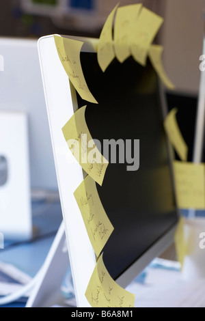 Post it notes on computer screen Stock Photo