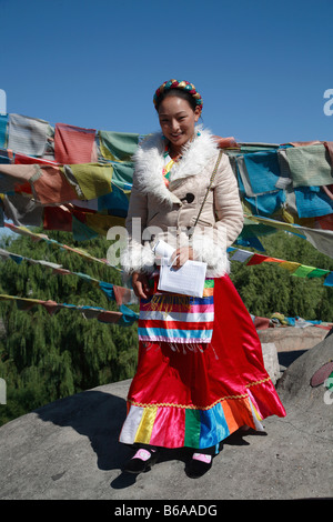 China Beijing Ethnic Culture Park Tibetan lady prayer flags Stock Photo