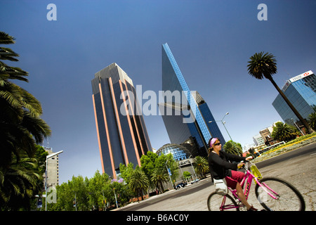 Mexico, Mexico city, The Stock Exchange building on Paseo de la Reforma and cyclist Stock Photo