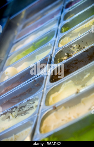 Assorted ice cream and gelato in trays at an ice cream parlor. Stock Photo