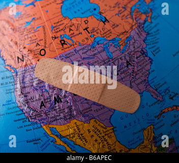 Band-Aid on globe showing North America Stock Photo