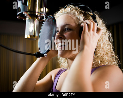 singing in a recording studio Stock Photo