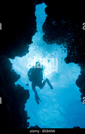 Cayman Islands Grand Cayman Island Scuba diver swimming near coral reef at Eden Rock in Caribbean Sea Stock Photo