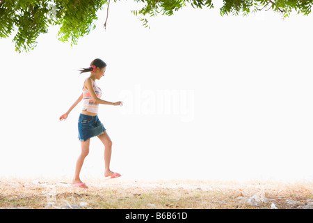 Young woman walking at beach Stock Photo
