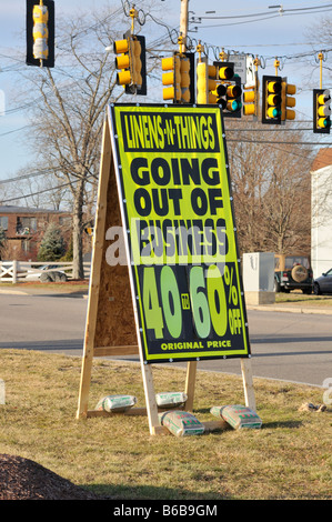 Sandwich board signs for retail store Linens and things going out of business sale. Stock Photo