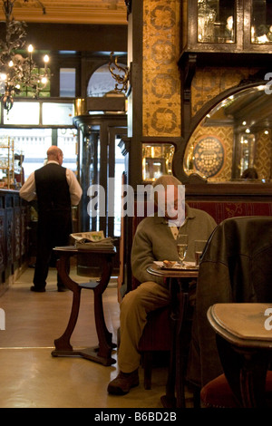 Lone single customer reading drinking seated in the Cafe Bar 'Le Cirio', Brussels, Belgium 2007. WWW.OLIVER-KNIGHT.BLOGSPOT.COM Stock Photo