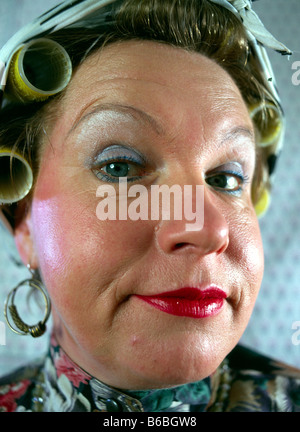 Portrait of woman with curlers in her hair Stock Photo