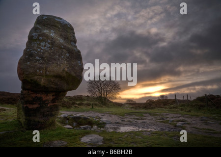 Winter sunrise at the Cork Stone on Stanton Moor, Peak District, Derbyshire, England Stock Photo