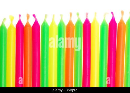 Row of unlit birthday candles isolated on white background Stock Photo