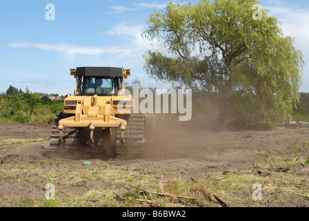 Yellow big bulldozer working in construction site Stock Photo