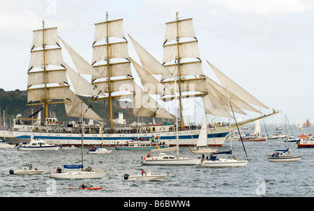 Russian Class A Tall Ship 'Mir' surrounded by smaller ships during Funchal Tall Ships Regatta, Falmouth, Cornwall, UK Stock Photo