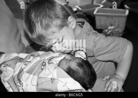 Newborn Baby sister and big brother Stock Photo