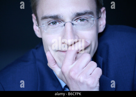 Portrait of businessman thinking Stock Photo