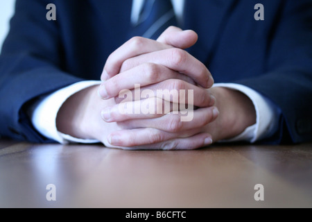 Midsection view of businessman sitting at table in office Stock Photo