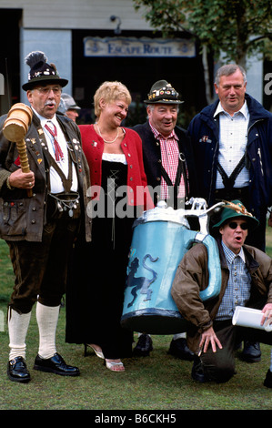 Oktoberfest Beer Festival, Whistler, BC, British Columbia, Canada - Happy Revelers singing and celebrating, Giant Beer Stein Stock Photo