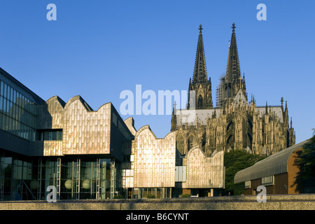 Museum and church in city, Museum Ludwig, Cologne Cathedral, Cologne, Rhineland, North Rhine-Westphalia, Germany Stock Photo
