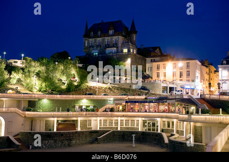 Buildings in city lit up at night, Port Vieux, Biarritz, Pyrenees-Atlantiques, Aquitaine, France Stock Photo