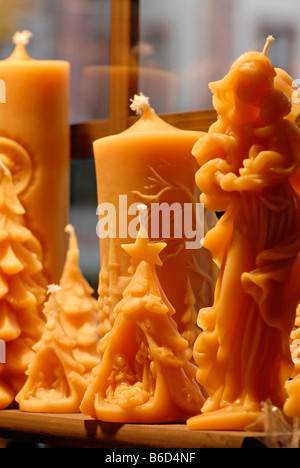 Motives from a christmas Market in a german city. Beeswax candles and figures Stock Photo