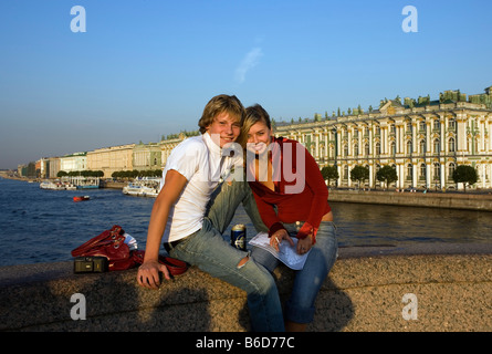 Russia, Saint Petersburg, Young couple on bridge over the neva River, background the Hermitage Stock Photo