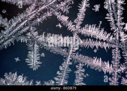 Frost crystals create patterns on a window Stock Photo