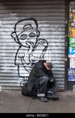 Homeless man sleeping on a New York City subway train Stock Photo - Alamy