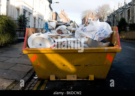 skip trash rubbish junk scrap throwaway dumpster can waste dispose disposal dump refuse disposal bin landfill uk tax Stock Photo