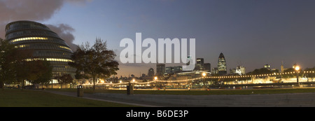 Panorama of evening sunset over City Hall and The City of London, across the Thames in the background Stock Photo