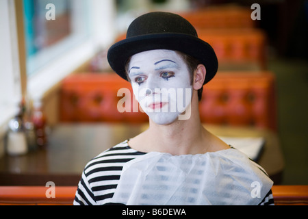 Young man, painted face, mime, smiling Stock Photo