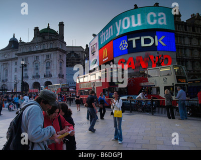 Tourists on Piccadilly Circus London UK Stock Photo