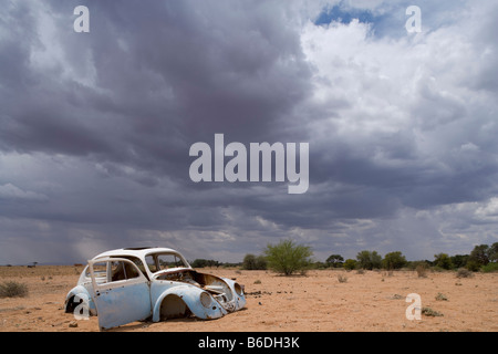 Africa Namibia Rusted and stripped remains of Volkswagen Beetle in desert Stock Photo