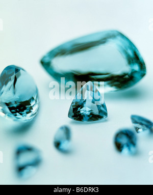 Aquamarine gems. Aquamarine is a transparent blue or blue-green variety of beryl (berylliumaluminium silicate). Stock Photo