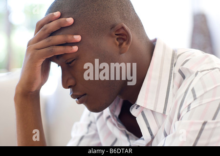 Stress. Unhappy man resting his head on his hand. Stock Photo