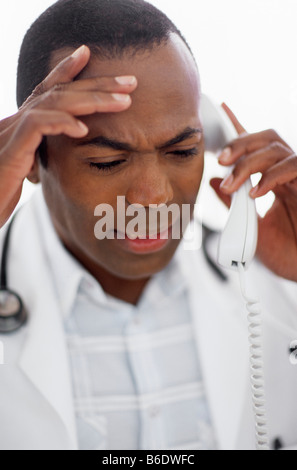 Male doctor making a telephone call. Stock Photo