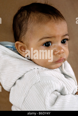 Baby girl sitting upright Stock Photo