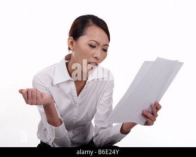 Businesswoman looking at documents Stock Photo