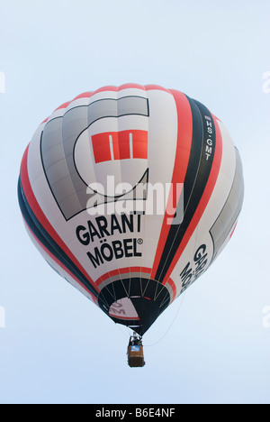 Hot air balloon with advertising for Garant Mobel Stock Photo