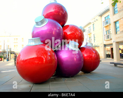 Giant baubles in the shopping mall,before Christmas,at the Cabot shopping Centre,Bristol,England,uk. Stock Photo