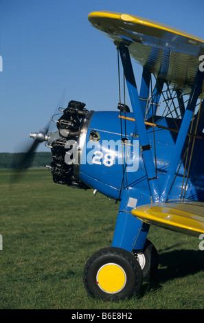 Old american trainer biplane Boeing PT-17 Kaydet / Stearman model 75 starting radial engine and ready to departure Stock Photo