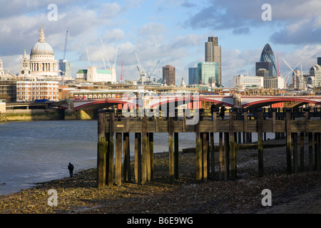 Saint Pauls Cathedral and the city of London financial centre viewed from across the River Thames in London, UK. Stock Photo