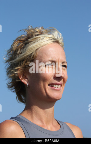 Portrait of a young blonde woman outdoors. Stock Photo