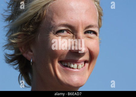 Portrait of a young blonde woman outdoors. Stock Photo