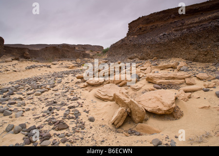 Africa Namibia Skeleton Coast Wilderness River sand and eroded desert sandstone along Uniab River delta Stock Photo