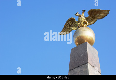 Two headed golden eagle obelisk in the market square Helsinki Finland Stock Photo