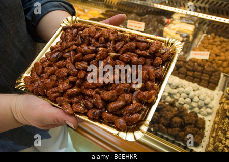 Caramel coated almonds at Salinas Cake Shop in Cervantes Square ALCALA DE HENARES Madrid Spain Stock Photo