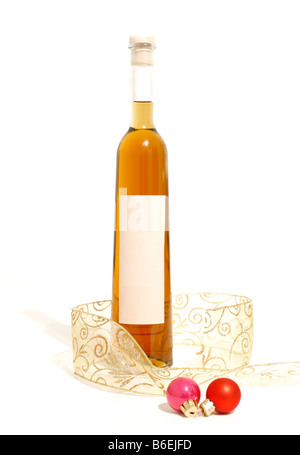 Bottle of orange grappa with ribbon and christmas balls Stock Photo