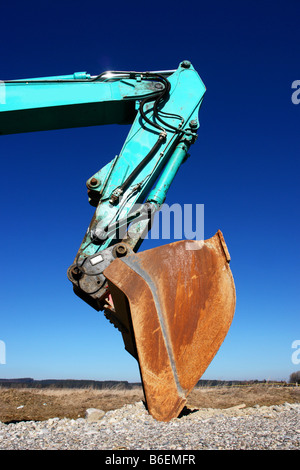 an excavator at a building site Stock Photo